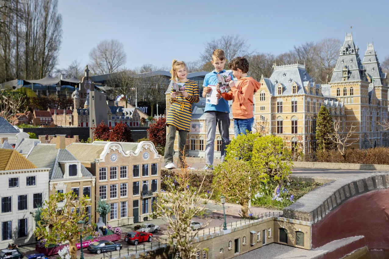 Children exploring miniature Dutch buildings at Madurodam.